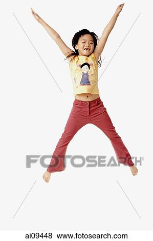 Stock Photo - Girl jumping in the air with outstretched arms.. Fotosearch