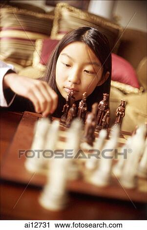 Girl playing with chess set View Large Photo Image Stock Image - Girl playing with chess set. Fotosearch