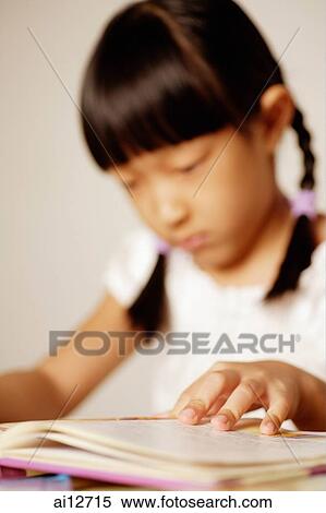 Stock Photography - Girl reading a book. Fotosearch
