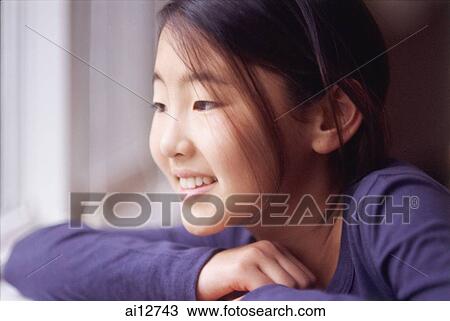 Stock Image - Girl smiling, looking away. Fotosearch