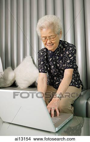 Grandmother using laptop View Large Photo Image Picture - Grandmother using laptop. Fotosearch