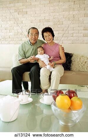 Picture - Grandparents with granddaughter. Fotosearch