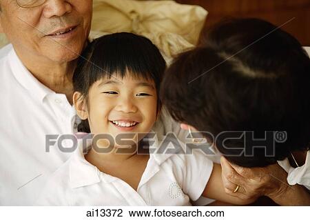 Grandparents with granddaughter View Large Photo Image Stock Image - Grandparents with granddaughter. Fotosearch