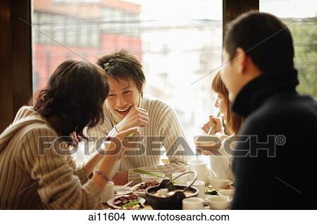 Group of friends at a Chinese restaurant View Large Photo Image Picture - Group of friends at a Chinese restaurant. Fotosearch