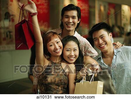 Group of friends looking at camera View Large Photo Image Stock Image - Group of friends looking at camera. Fotosearch