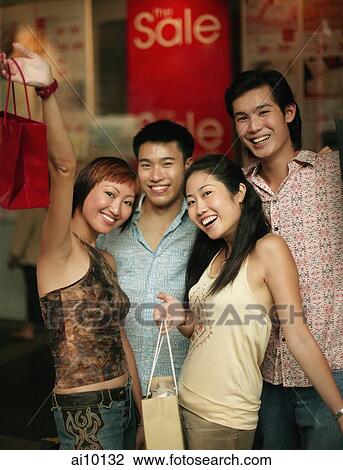 Group of friends looking at camera, posing View Large Photo Image Stock Image - Group of friends looking at camera, posing. Fotosearch