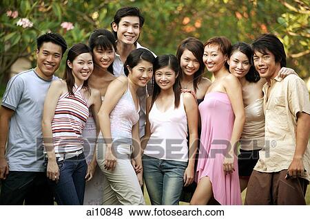Group of friends looking at camera, smiling View Large Photo Image Stock Photo - Group of friends looking at camera, smiling. Fotosearch