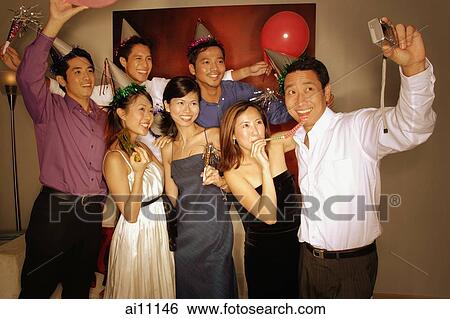 Stock Photograph - Group of friends posing for a picture. Fotosearch