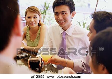Group of young adults talking at bar View Large Photo Image Stock Photography - Group of young adults talking at bar. Fotosearch