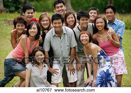 Stock Photo - Group of young people looking at camera. Fotosearch