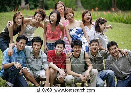 Stock Photo - Group of young people posing for camera. Fotosearch