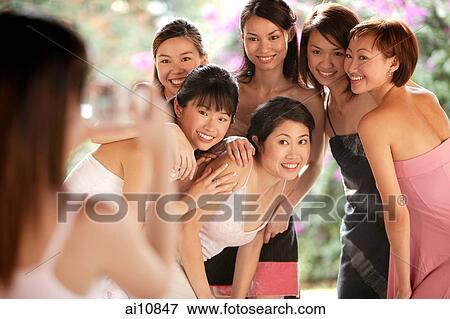 Group of young women, posing for camera, smiling View Large Photo Image Stock Photo - Group of young women, posing for camera, smiling. Fotosearch