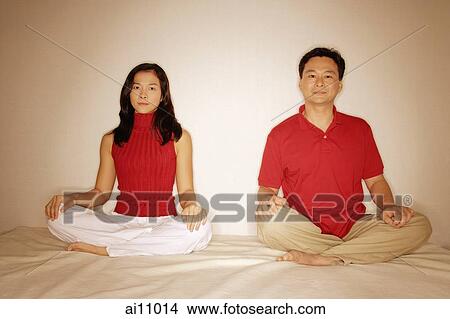 Man and woman sitting side by side, legs crossed View Large Photo Image Picture - Man and woman sitting side by side, legs crossed. Fotosearch