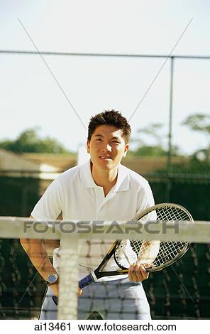 Man holding tennis racket, waiting to be served View Large Photo Image Stock Image - Man holding tennis racket, waiting to be served. Fotosearch