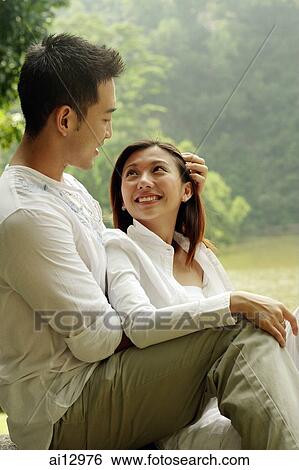 Man hugging woman, woman looking up at him View Large Photo Image Stock Photograph - Man hugging woman, woman looking up at him. Fotosearch