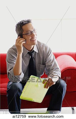 Man in shirt and tie, using mobile phone View Large Photo Image Stock Photo - Man in shirt and tie, using mobile phone. Fotosearch