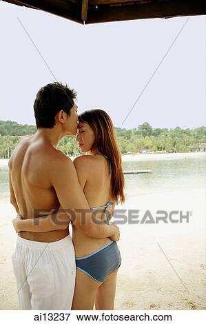 Man kissing woman on forehead, rear view View Large Photo Image Stock Photo - Man kissing woman on forehead, rear view. Fotosearch