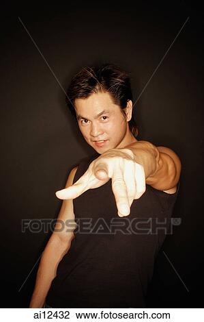 Man looking at camera, pointing finger View Large Photo Image Stock Image - Man looking at camera, pointing finger. Fotosearch