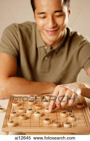 Man playing Chinese chess View Large Photo Image Stock Photography - Man playing Chinese chess. Fotosearch