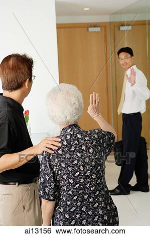 Mature man and woman waving, younger man waving back View Large Photo Image Stock Photograph - Mature man and woman waving, younger man waving back. Fotosearch