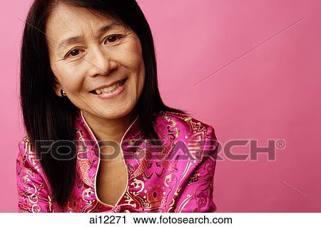 Mature woman looking at camera, portrait View Large Photo Image Stock Image - Mature woman looking at camera, portrait. Fotosearch