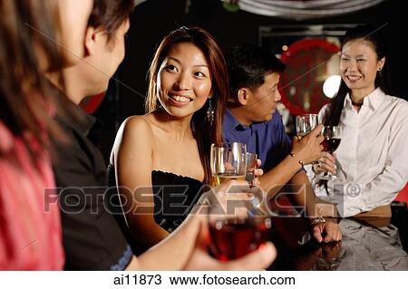 Men and women at bar, drinking View Large Photo Image Stock Image - Men and women at bar, drinking. Fotosearch