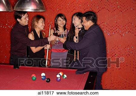 Men and women standing around pool table. View Large Photo Image Stock Photo - Men and women standing around pool table.. Fotosearch