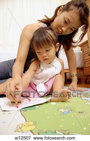 Stock Photo - Mother and child drawing with crayons. Fotosearch