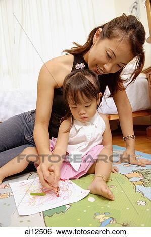 Mother and daughter drawing with crayons View Large Photo Image Stock Photograph - Mother and daughter drawing with crayons. Fotosearch