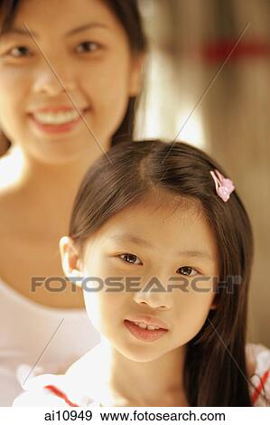 Mother and daughter, looking at camera View Large Photo Image Stock Photo - Mother and daughter, looking at camera. Fotosearch
