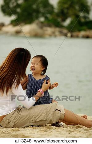 Mother with daughter at beach View Large Photo Image Stock Photo - Mother with daughter at beach. Fotosearch