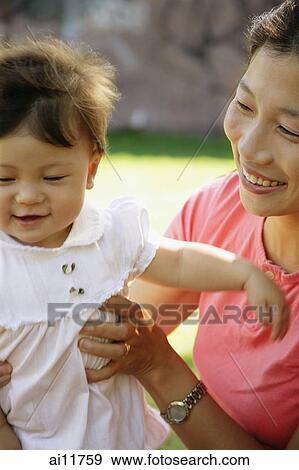 Stock Photo - Mother with daughter, bonding. Fotosearch