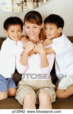 Mother with two children View Large Photo Image Stock Image - Mother with two children. Fotosearch