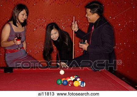 Stock Image - People playing pool. Fotosearch