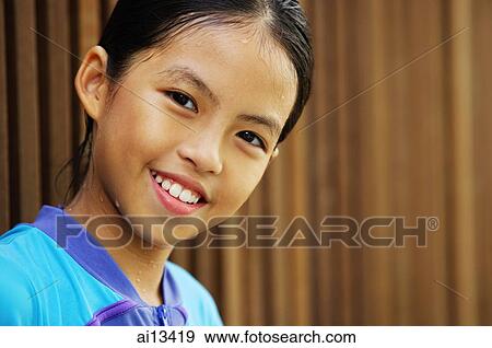 Portrait of a young girl, looking at camera View Large Photo Image Stock Photo - Portrait of a young girl, looking at camera. Fotosearch