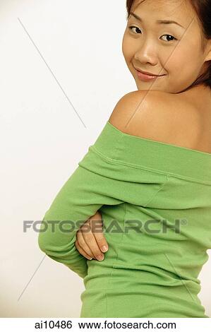 Portrait of a young woman, looking at camera View Large Photo Image Stock Photograph - Portrait of a young woman, looking at camera. Fotosearch