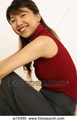 Portrait of a young woman, smiling View Large Photo Image Stock Photography - Portrait of a young woman, smiling. Fotosearch