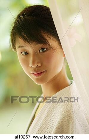 Portrait of a young woman View Large Photo Image Stock Photo - Portrait of a young woman. Fotosearch
