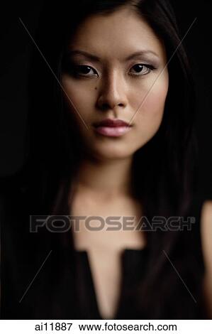Stock Photo -  Portrait of a young woman. Fotosearch