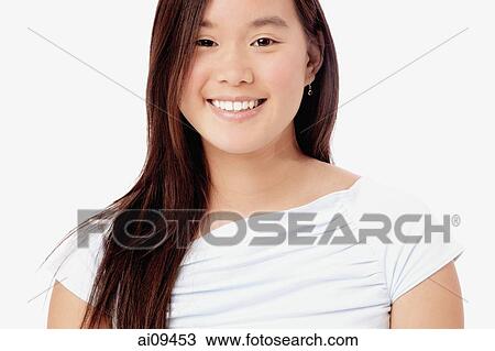 Portrait of young woman, smiling View Large Photo Image Stock Image - Portrait of young woman, smiling. Fotosearch