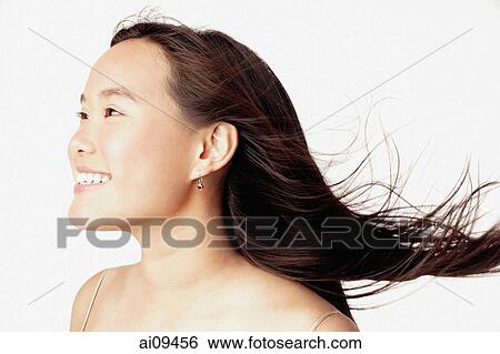 Profile of young woman, smiling View Large Photo Image Stock Photograph - Profile of young woman, smiling. Fotosearch