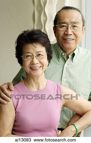 Senior couple looking at camera, portrait View Large Photo Image Stock Image - Senior couple looking at camera, portrait. Fotosearch