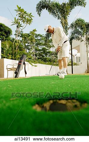 Senior man playing golf View Large Photo Image Stock Image - Senior man playing golf. Fotosearch