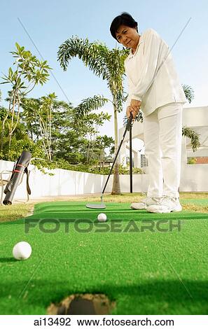Senior woman playing golf View Large Photo Image Stock Image - Senior woman playing golf. Fotosearch