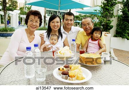 Stock Photo - Three generation family, family portrait. Fotosearch