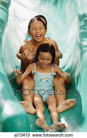 Three girls going down water slide View Large Photo Image Stock Photography - Three girls going down water slide. Fotosearch