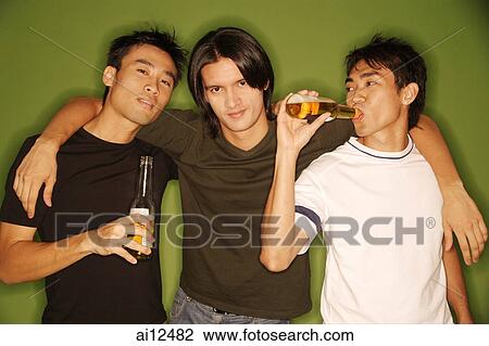 Three young men, arm around each other, facing camera View Large Photo Image Stock Image - Three young men, arm around each other, facing camera. Fotosearch