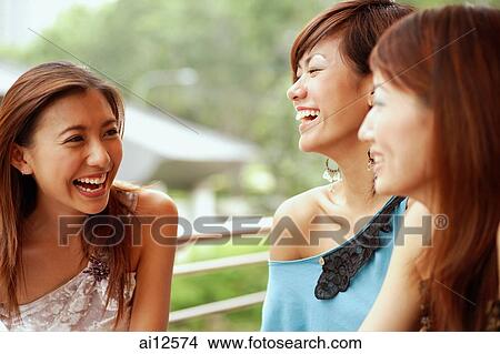 Three young women, smiling View Large Photo Image Picture - Three young women, smiling. Fotosearch