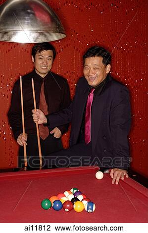 Two businessmen at pool table View Large Photo Image Stock Image - Two businessmen at pool table. Fotosearch