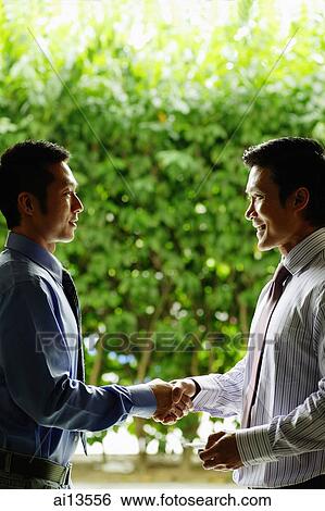 Two businessmen shaking hands View Large Photo Image Stock Photograph - Two businessmen shaking hands. Fotosearch